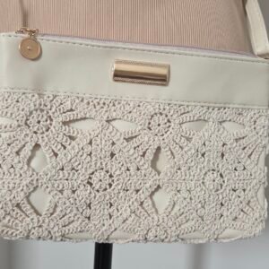 An elegant purse, beige, lace.